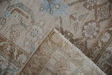 Distressed vintage Hamadan rug corner, showcasing platinum and bronze Herati motif and woven back.