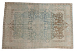 Faded powder blue and coffee brown distressed Malayer rug with central botanical medallion, 4'4