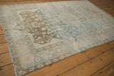 Distressed Malayer rug corner, coffee brown germinating finials, powder blue and ivory tones.