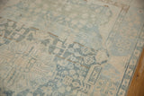 Distressed vintage Malayer rug, faded powder blue and ivory motifs, with visible wear to knot heads.