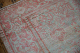 The Samovar border of a vintage Mahal rug with worn pile showing the hand-knotted texture.