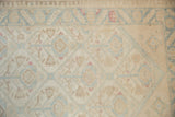 Distressed Malayer runner's ivory field features powder blue lattice and soft raspberry accents.