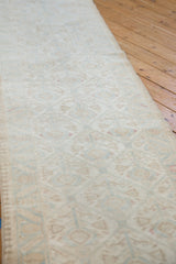 Faded ivory, powder blue, and soft raspberry motifs on distressed Malayer runner.