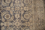 Distressed dusty navy and ivory Herati motif, foundation showing through, with serrated border.