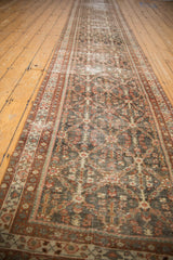 Elongated distressed vintage Mahal runner with charcoal navy, rust, ivory trellis motif.