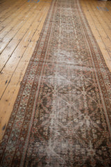 Distressed Mahal runner's aged pile texture, madder root and ivory border patterns, intact selvage.