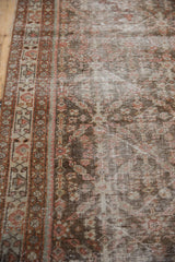 Distressed vintage Mahal runner, showcasing muted rust, ivory trellis motif, and foundation wear.