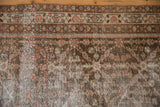 Distressed vintage Mahal runner pile, revealing worn knot heads and exposed foundation.