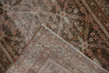 Vintage Mahal runner corner revealing distressed pile, foundation, and secured selvage.