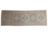 Vintage Distressed Karaja runner with geometric eagle medallions in beige, denim blue, and ivory, 3'6