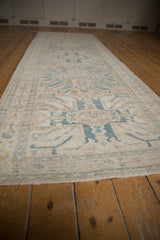 Distressed pile, geometric floral border, and stylized medallions on a vintage Karaja runner.