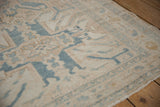 Distressed vintage Karaja rug pile, geometric motifs in beige, sky blue, showing faint foundation.
