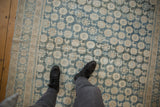 Distressed Mahal carpet with mostly even wear, featuring faded blue and ivory floral, animal motifs underfoot.
