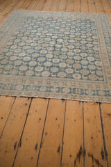 Vintage Distressed Mahal rug edge showing blue, beige, and herded animal patterns with faint foundation.