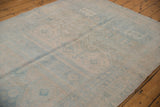 Distressed texture and softened powder blue, beige geometric patterns of the vintage Bijar runner.