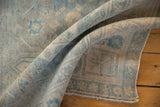 Distressed hand knotted Bijar runner edge with even wear and powder blue pile.