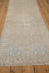 Distressed vintage Borchalou runner end, dusty blue shield finial, germinating blossoms.