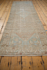 Distressed Borchalou runner, showing mostly even wear across faded beige and dusty blue field.