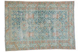 Distressed Malayer rug featuring dusty sky blue vinery, terracotta florals, and serrated borders. 3'3