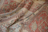 Soft, elegant folds of a vintage Serab rug runner showing its pliable texture and worn pile.
