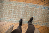 Distressed vintage Persian Hamadan runner, beige and blue Herati motif, even wear.