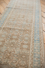 Distressed Hamadan runner's beige Herati motif and powder blue germinating plant border.