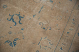 Detail of a vintage distressed Sivas carpet with worn sand pile and sky blue palmette motifs.