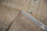 Distressed Sivas carpet corner: even pile wear, visible foundation, and secured selvage.