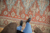 Antique Distressed Soumac Carpet with pale blue main border, oversized palmettes, and floral field.