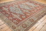 Distressed field of antique Caucasian Soumac carpet with floral cross-sections in cherry red, denim blue.