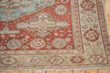 Distressed cherry red field and oversized pale palmette border of antique Soumac carpet.