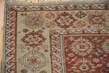 Corner detail of antique Caucasian Soumac carpet, black cherry red palmette border, pale seafoam green field motifs.
