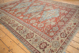 Antique handwoven Soumac carpet corner, pale seafoam border with oversized palmettes, red field floral motifs.
