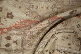 Distressed vintage Soumac rug showing soft texture and geometric motifs in brick red, brown, and platinum.
