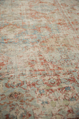 Distressed antique Soumac carpet with visible foundation, worn cherry red, and sky blue patterns.