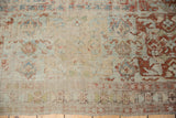 Distressed antique Soumac carpet texture, showing foundation, faded sky blue, cherry red, and beige motifs.