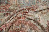 Distressed antique Soumac carpet, flatweave texture, geometric motifs in red, blue, beige.