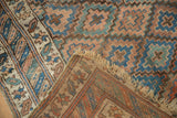Fringed edge and woven foundation detail of the antique Kurdish rug.