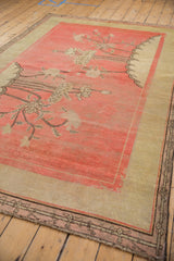 Antique Khotan carpet: blush field, ivory and coffee brown pictorial long-stemmed blossoms.