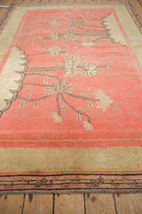 Antique Khotan carpet's geometric border in coffee brown and pale saffron with secured fringe.