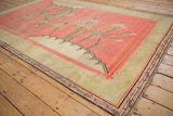Antique Khotan carpet corner with decorative coffee brown and pink border, and original aged fringe.