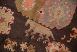 Pictorial horse motif detail on vintage Khotan rug with chocolate brown and peach.