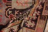 Textured hand-knotted Khotan carpet with chocolate, ivory, peach, mauve geometric patterns.