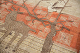 Vintage Khotan pictorial rug detail: coffee brown deer, tree, and terracotta snowflake-like leaves.