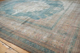 Faded powder blue and cochineal red border on a vintage Distressed Khorassan carpet corner.