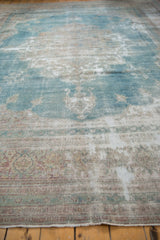 Distressed texture of vintage Khorassan carpet with faded powder blue, ivory, and visible foundation.