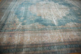 Visible foundation and time-softened powder blue hues on a distressed Khorassan carpet.