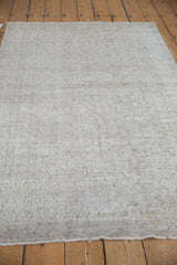 Distressed vintage Sparta rug texture with wear to foundation and faint scrolling vinery pattern.