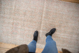 Close-up view of the distressed, low-pile texture on a vintage Turkish Sparta rug runner.