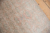 Visible wear to the foundation and knot heads of a distressed Turkish Sparta rug runner.